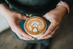 Serving a flat white or latte with latte art.
