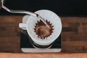 Craft or specialty coffee training, class in Chicago and Chicagoland. Making pour over coffee, Kalita Wave, pouring water over coffee grounds.